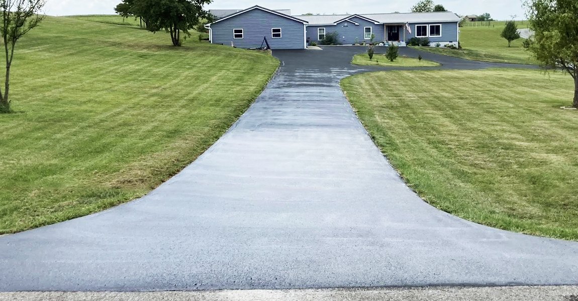 Freshly sealed asphalt driveway after sealcoating in North Lewisburg, OH
