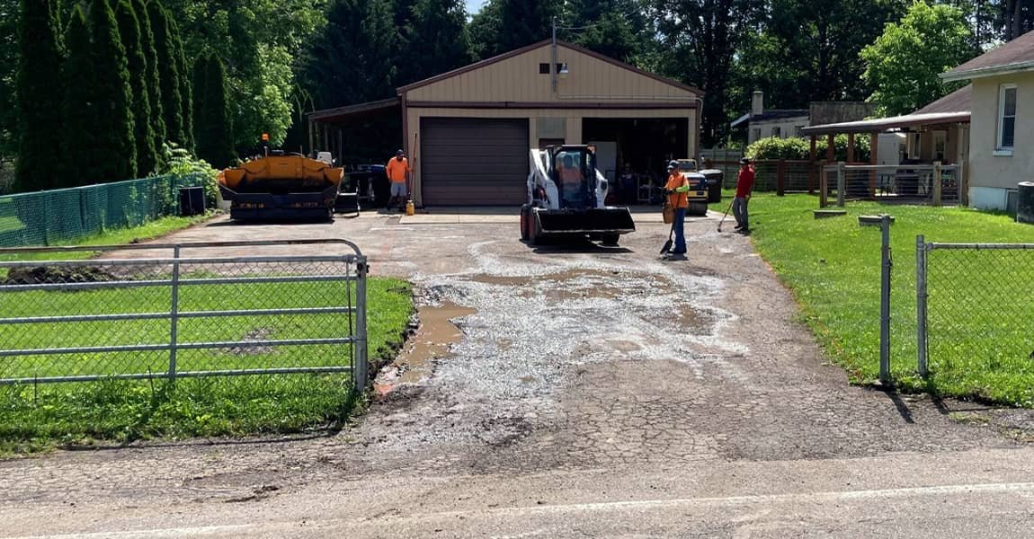 Cracked residential driveway before paving in Raymond, OH