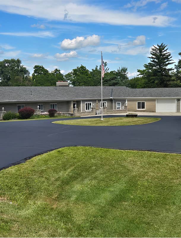 Freshly sealed circular driveway at a home in Bellefontaine, OH