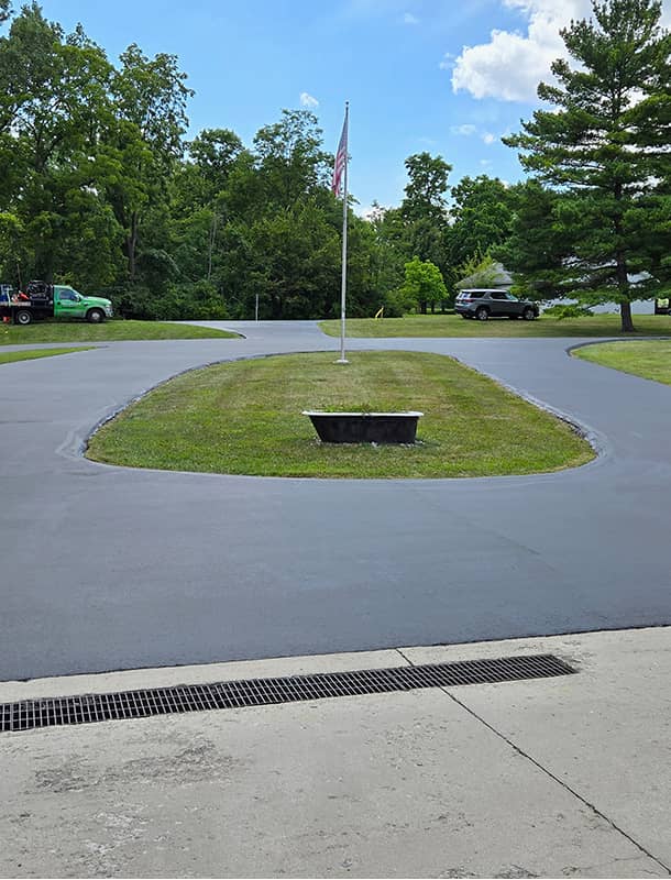 Smooth black circular driveway at a Bellefontaine, OH home