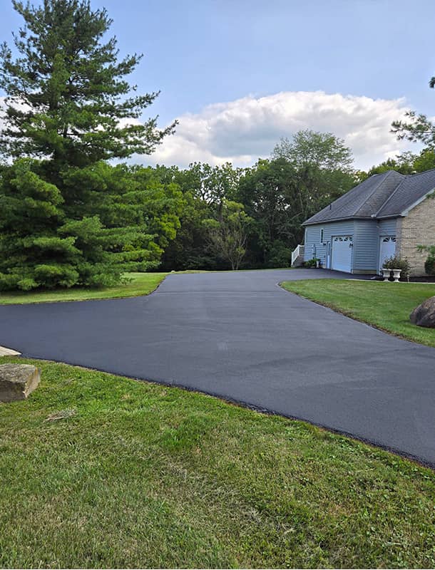 Freshly sealed residential driveway near Ostrander, OH