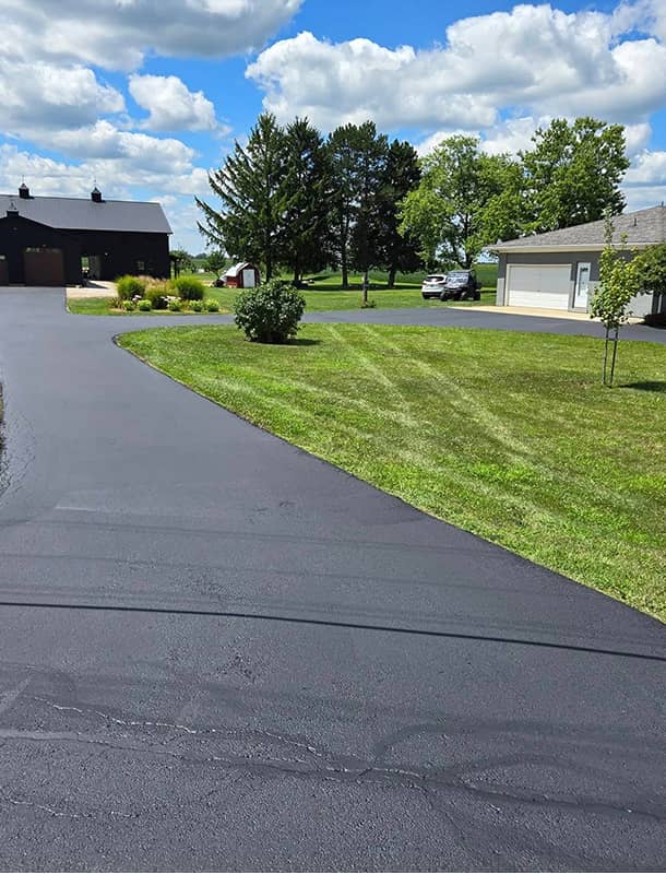 Freshly sealed farmhouse driveway and barn approach in Milford Center, OH