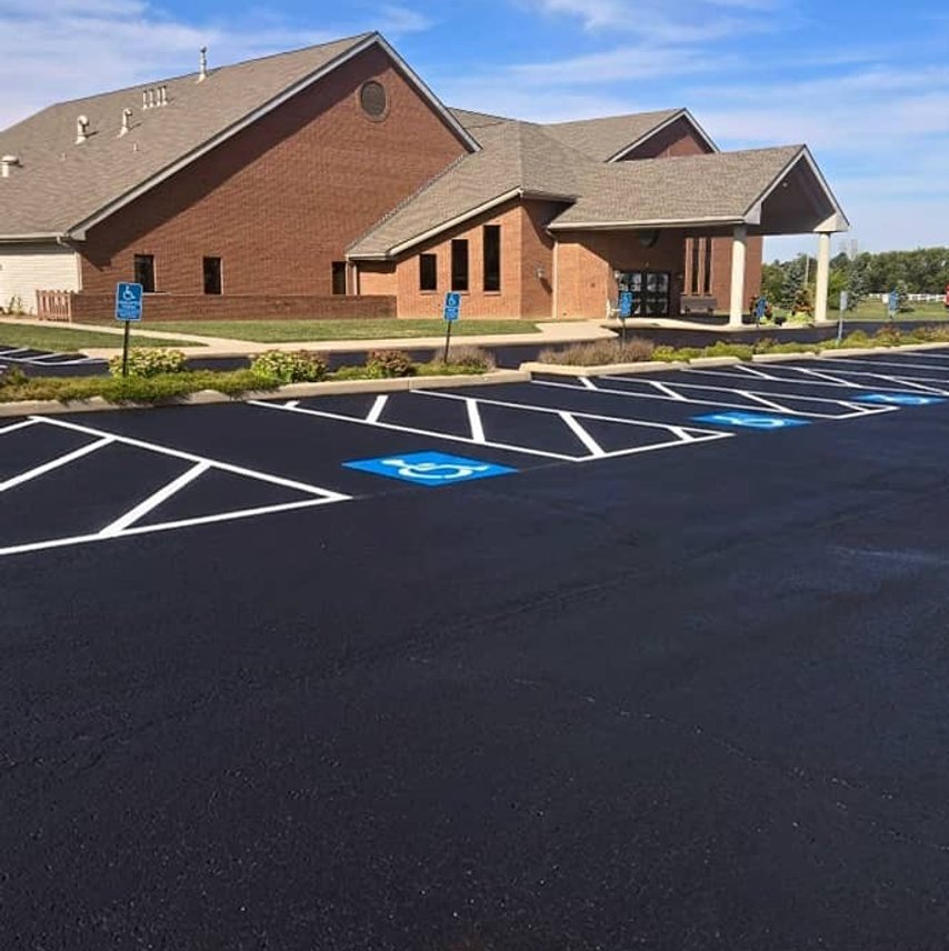 Freshly striped parking lot with ADA spaces in Plain City, OH